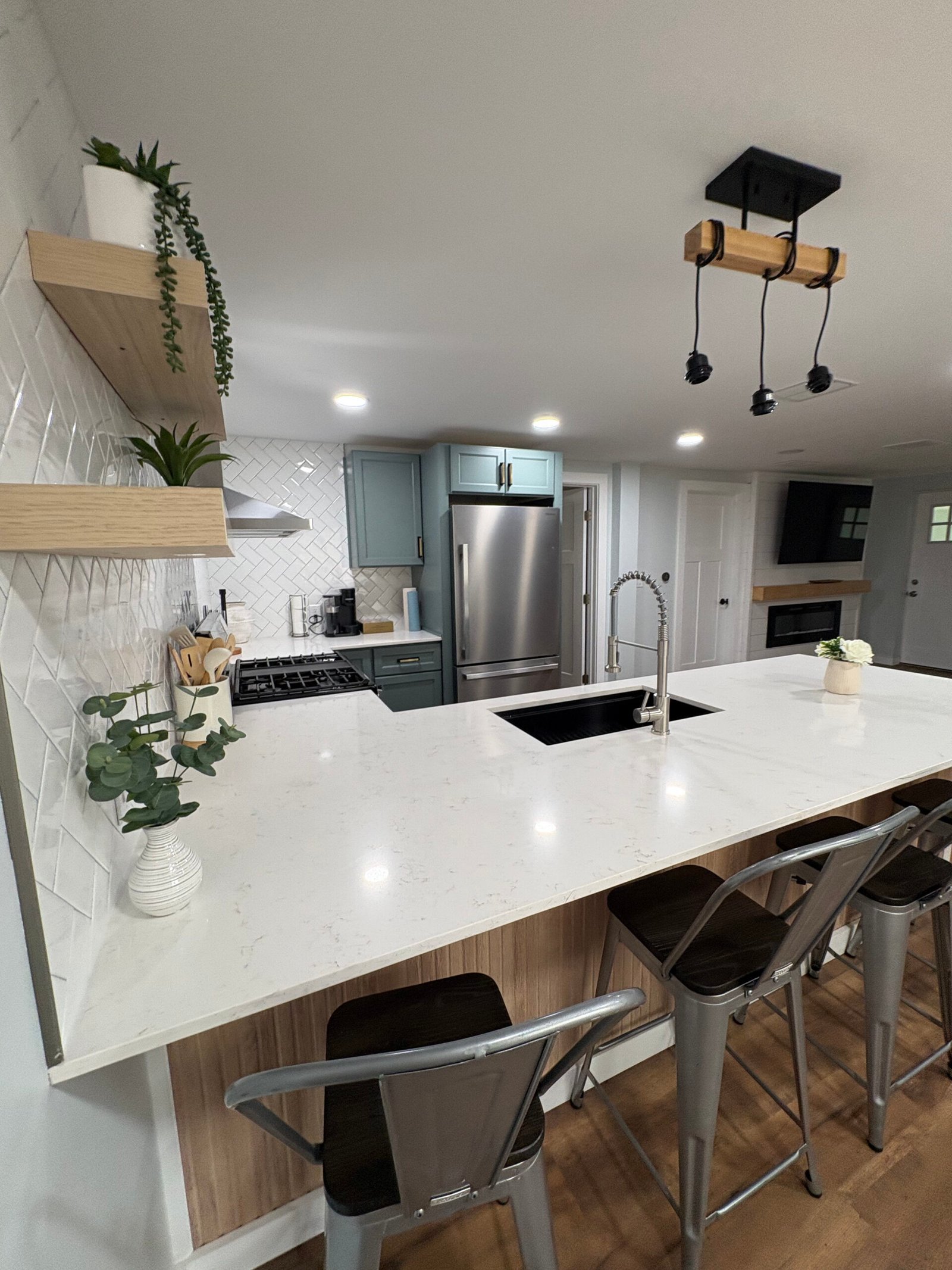 Kitchen remodel with gray cabinets and stainless appliances in Benton Harbor, MI