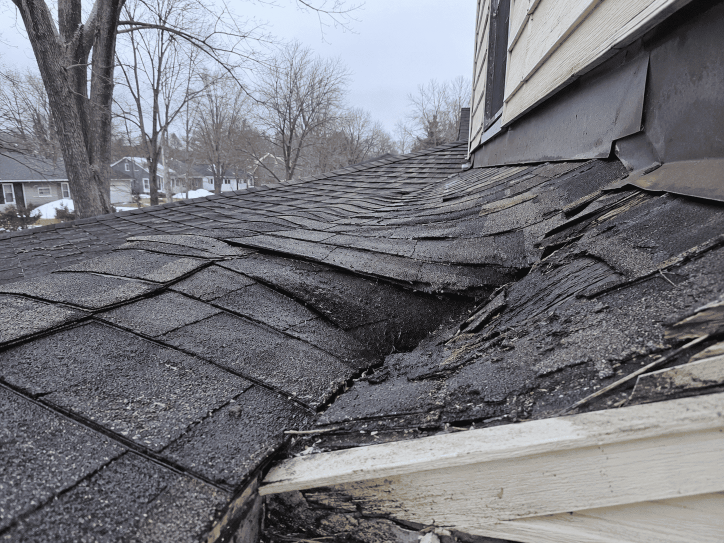Storm-damaged roof shingles in Benton Harbor, MI