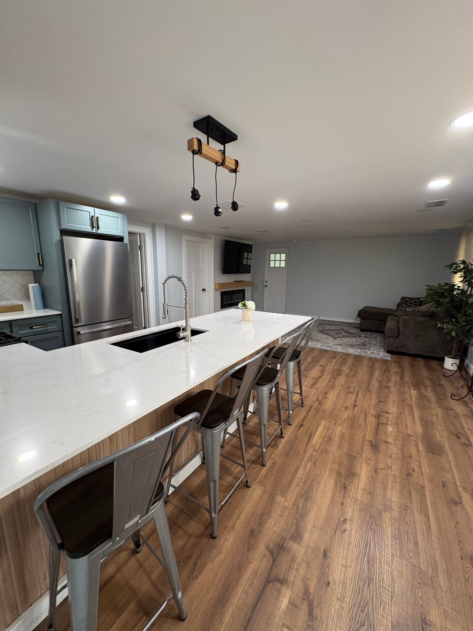 Modern kitchen remodel with white island and farmhouse sink in Benton Harbor, MI
