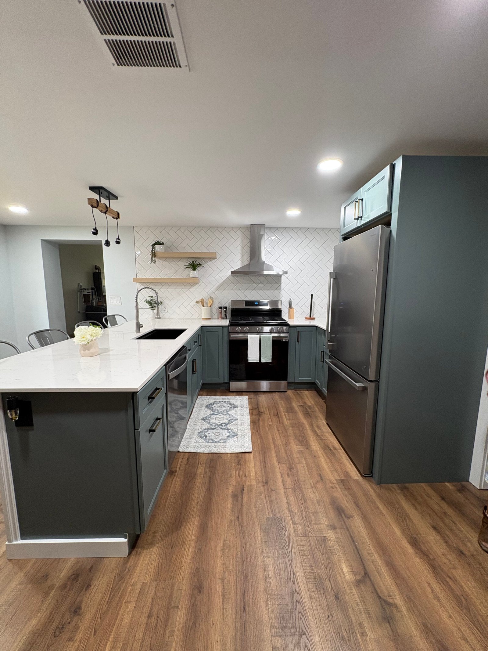 Kitchen remodel with white cabinets and dark countertop in Benton Harbor, MI