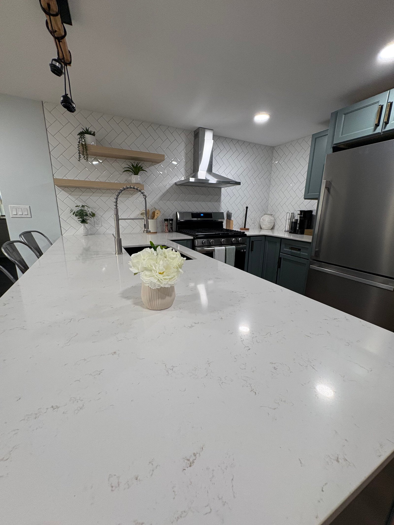 Kitchen remodel with white island and gas range in Benton Harbor, MI
