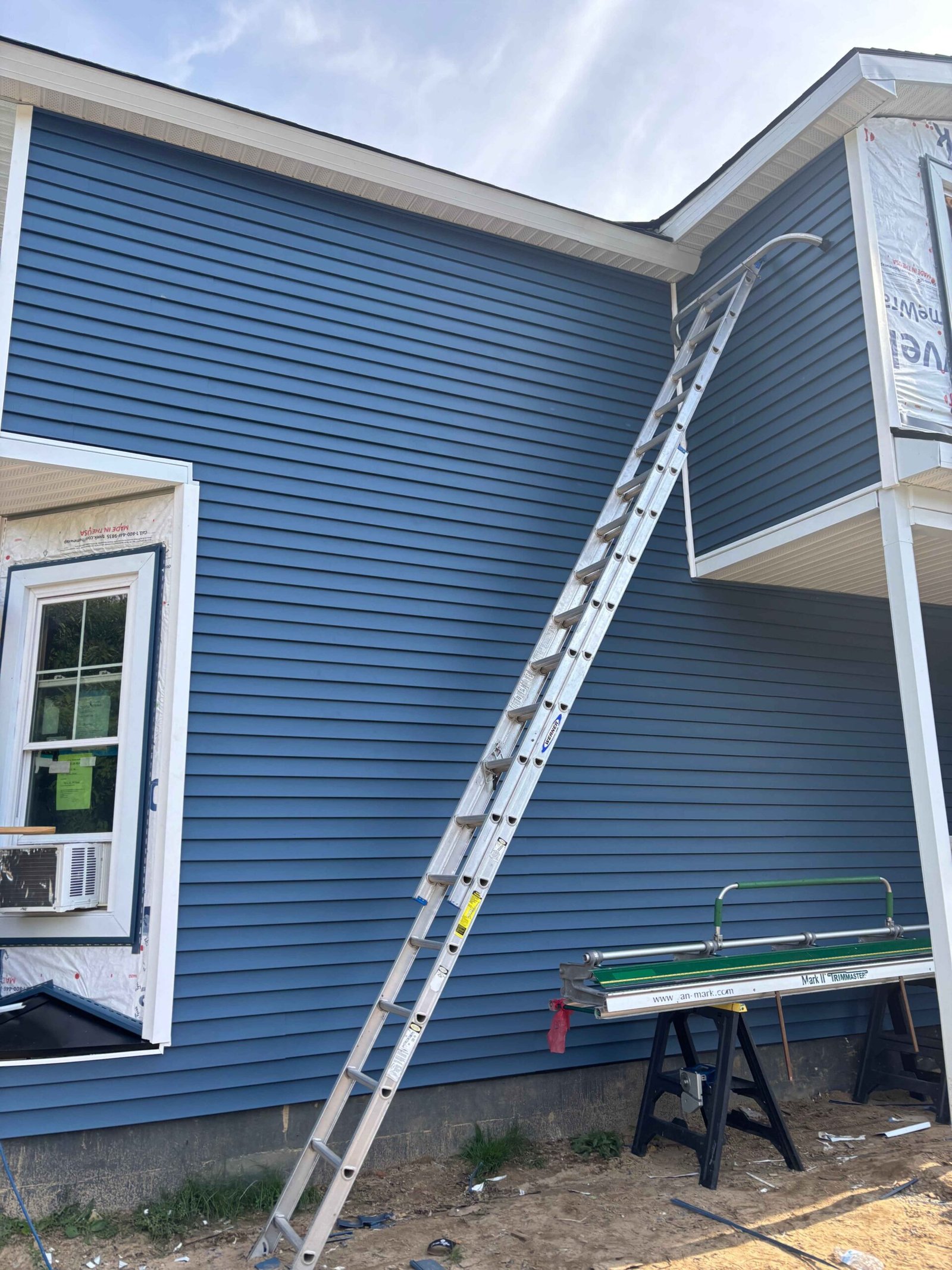 Finished blue siding with white trim in Benton Harbor, MI